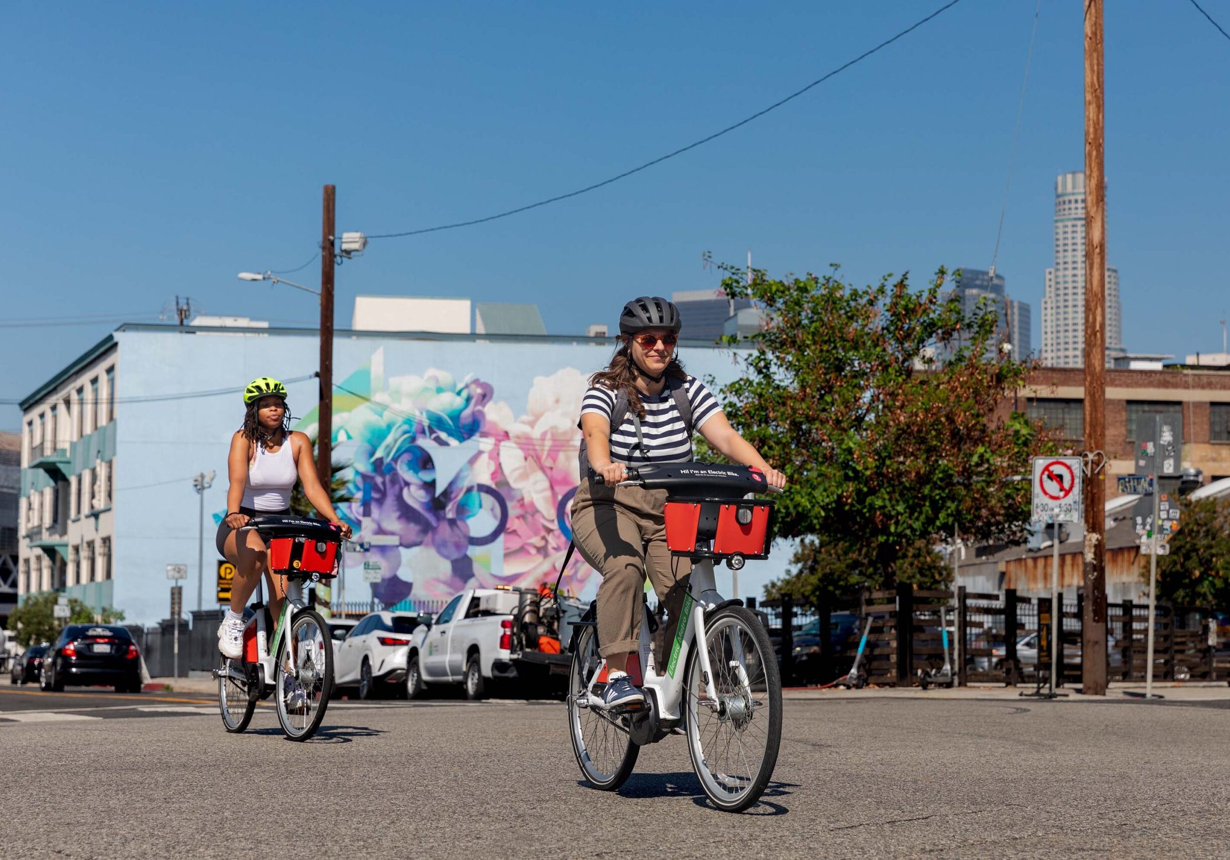 Two friends riding a Metro Bike